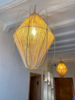 Diamond raffia pendant light with sculptural handwoven cage design