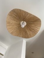 Sculptural raffia pendant light with handmade folded petal shade