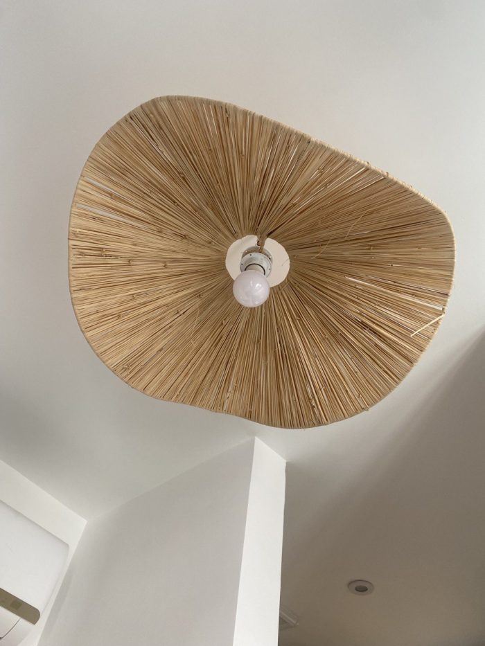 Sculptural raffia pendant light with handmade folded petal shade
