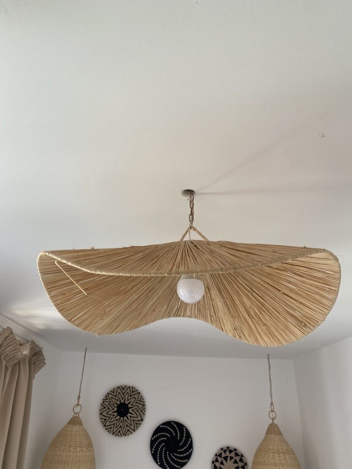 Sculptural raffia pendant light with handmade folded petal shade