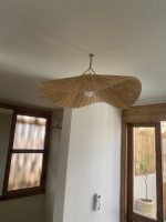 Sculptural raffia pendant light with handmade folded petal shade