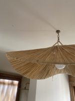 Sculptural raffia pendant light with handmade folded petal shade