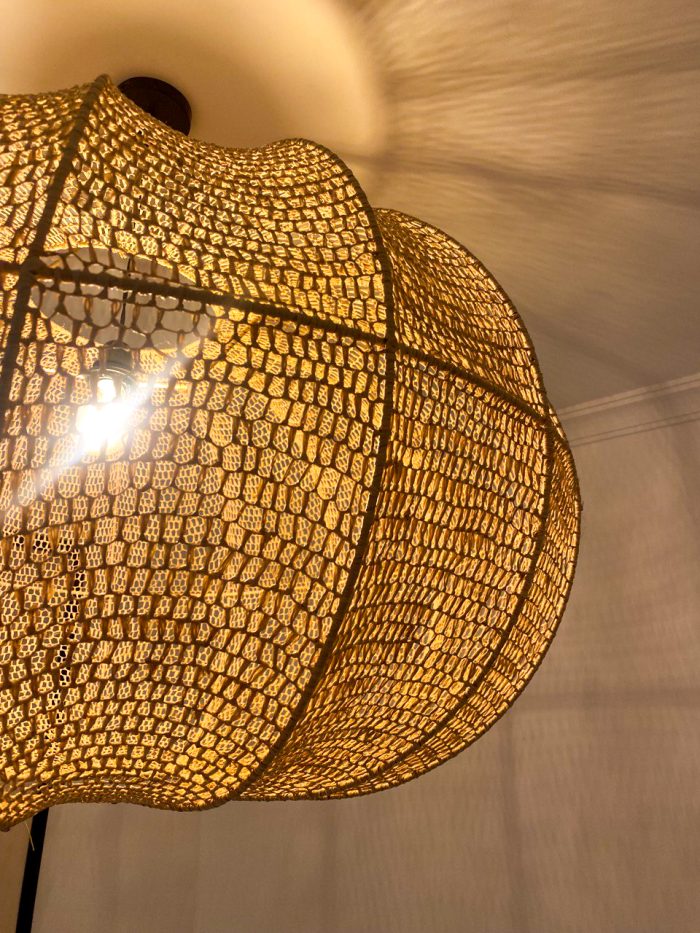 Handmade wavy raffia pendant light with ribbed pumpkin shape
