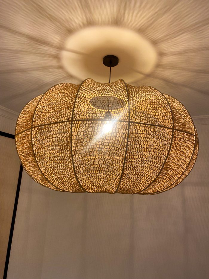 Handmade wavy raffia pendant light with ribbed pumpkin shape