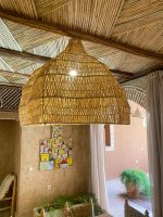 Oversized raffia pendant light with handmade Moroccan wavy dome shape