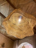 Oversized raffia pendant light with handmade Moroccan wavy dome shape