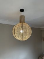 Round raffia pendant light handmade in Morocco with woven globe shape