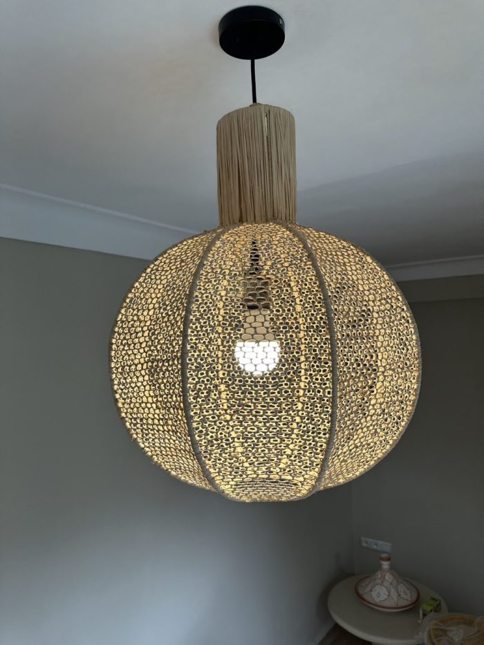 Round raffia pendant light handmade in Morocco with woven globe shape