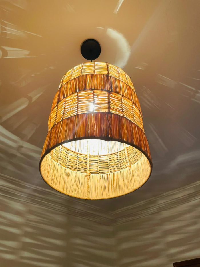 Tiered raffia pendant light with handwoven bell shaped shade