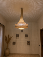 Handmade rope pendant light with long neck and tiered circular shape