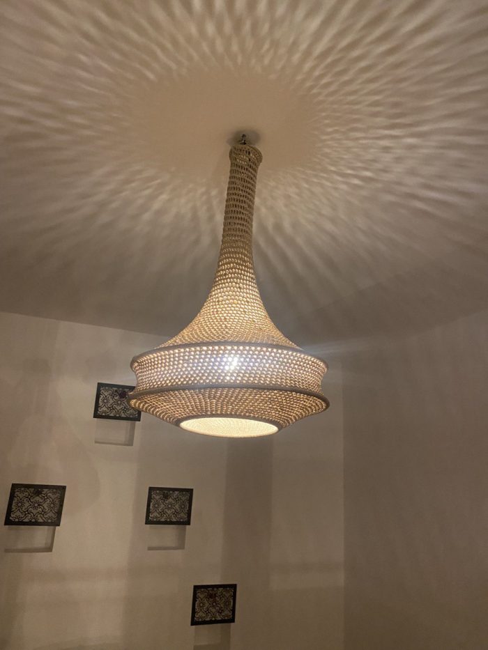 Handmade rope pendant light with long neck and tiered circular shape