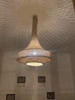 Handmade rope pendant light with long neck and tiered circular shape