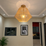 Handmade raffia pendant light with wide flared woven shape