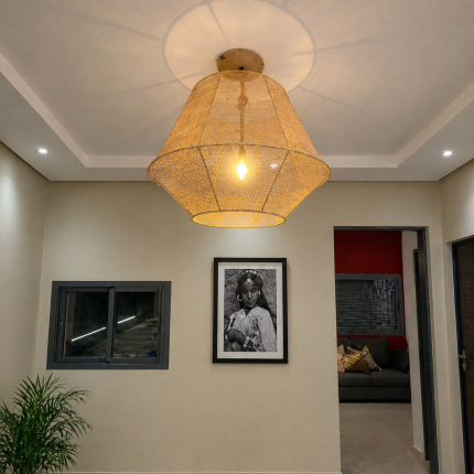 Handmade raffia pendant light with wide flared woven shape