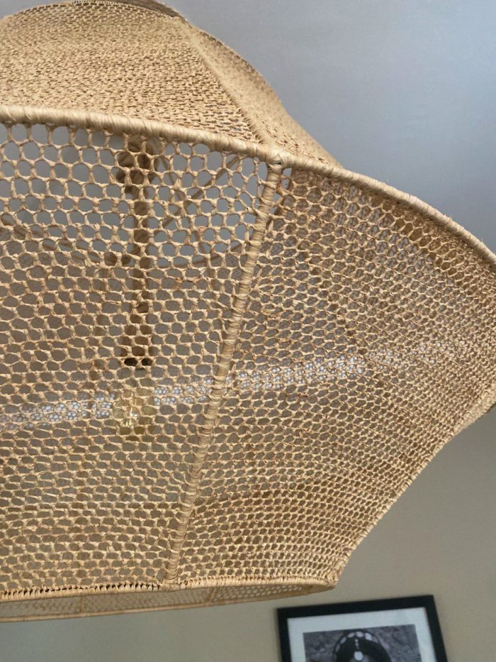 Handmade raffia pendant light with wide flared woven shape