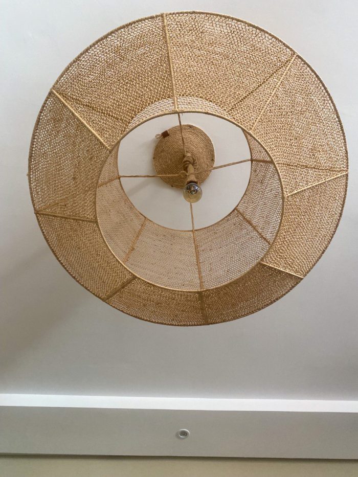 Handmade raffia pendant light with wide flared woven shape