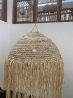 Moroccan straw ball pendant light with long natural raffia fringe