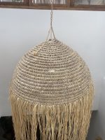 Moroccan straw ball pendant light with long natural raffia fringe