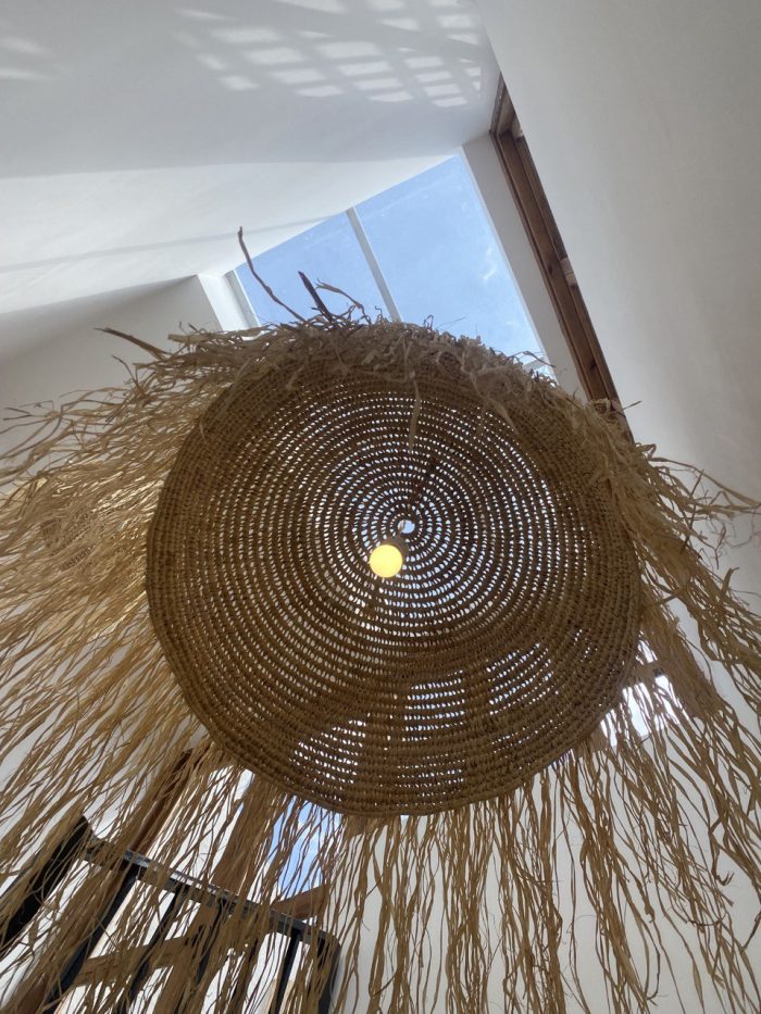 Moroccan straw ball pendant light with long natural raffia fringe