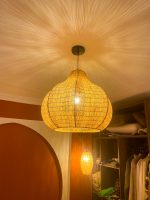 Sculptural raffia pendant light with rounded handmade Moroccan woven shade