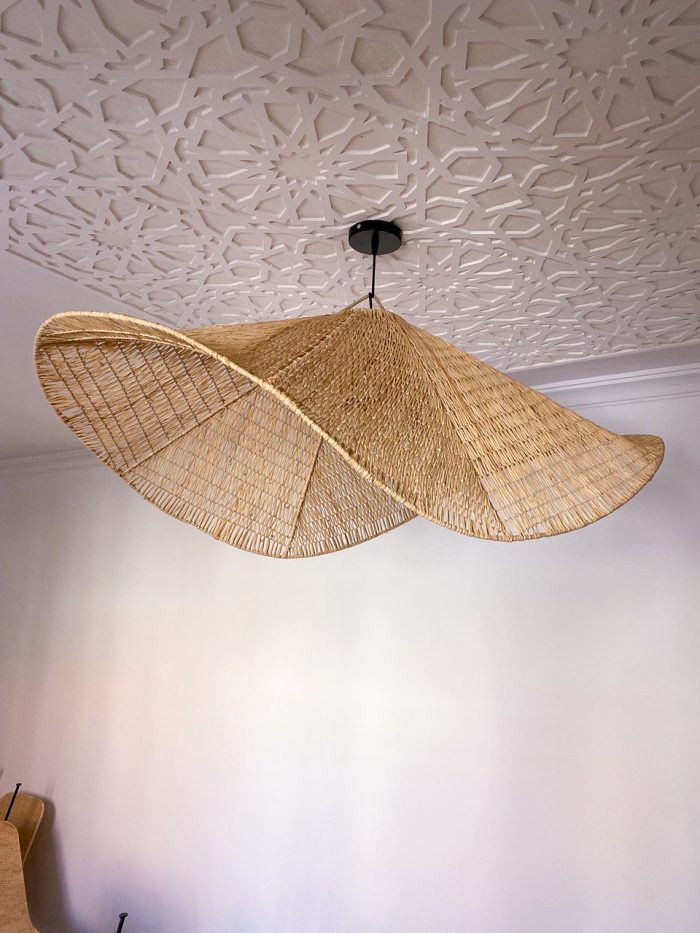 Handmade wavy raffia pendant light with sculptural woven dome shape
