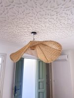 Handmade wavy raffia pendant light with sculptural woven dome shape