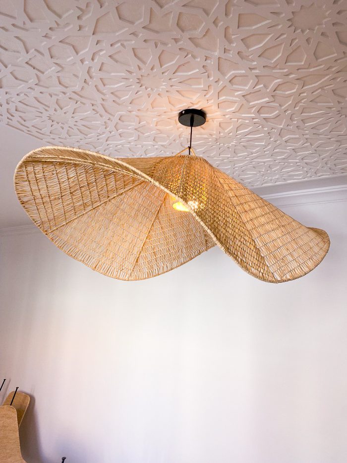 Handmade wavy raffia pendant light with sculptural woven dome shape