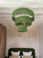 Green fringe chandelier with three tier cascading design
