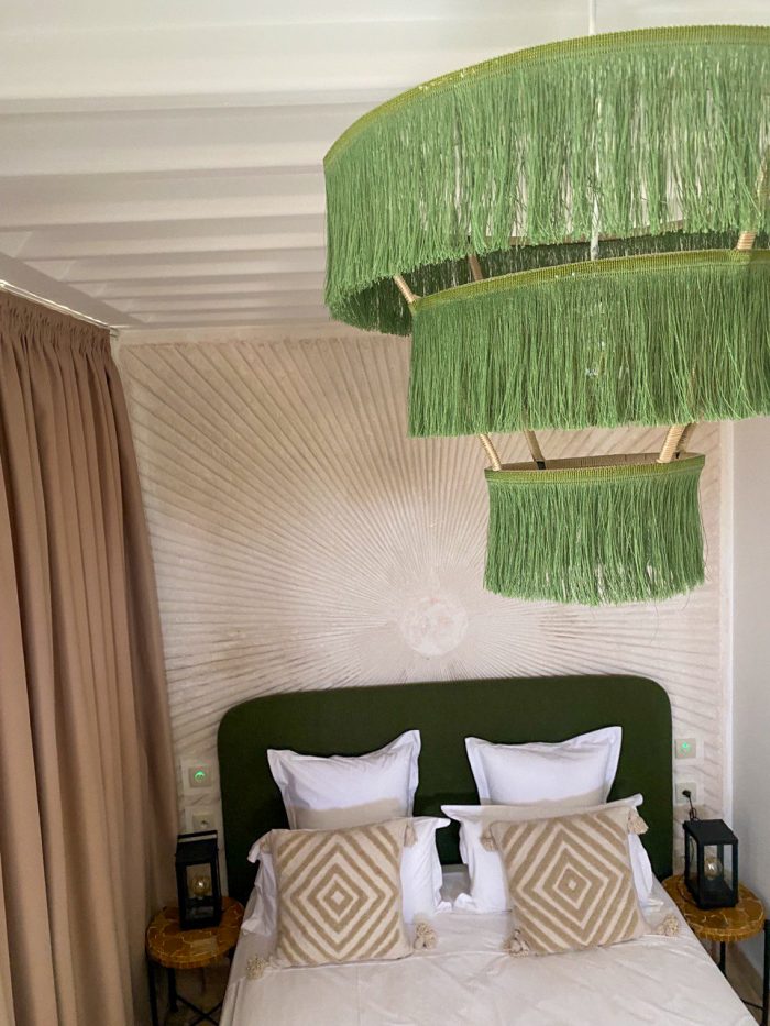 Green fringe chandelier with three tier cascading design