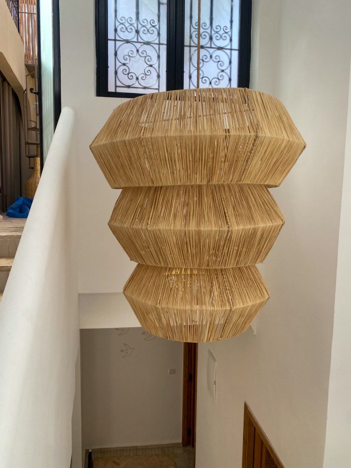 Tiered raffia pendant light with three geometric handwoven sections