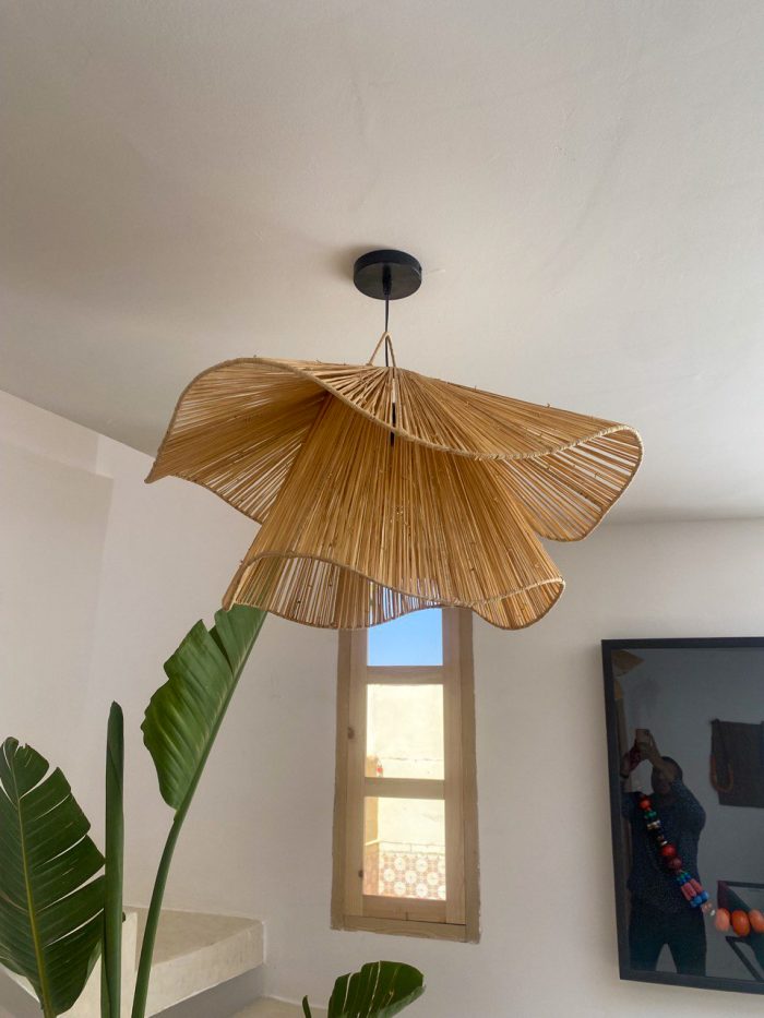 Handmade wavy flower raffia pendant light with layered natural woven petals