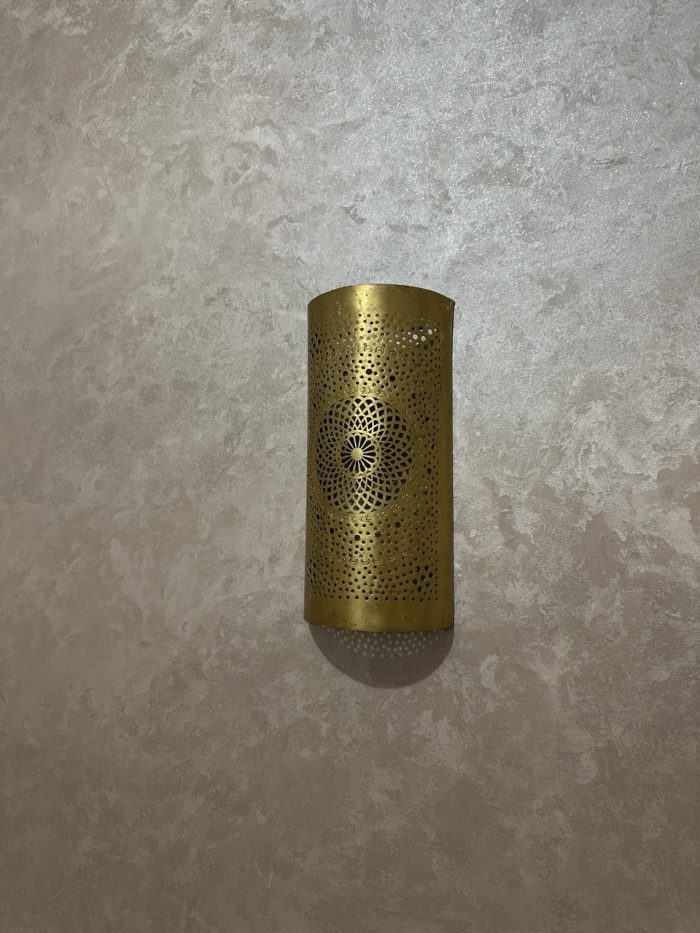 Handmade radiant rosette brass wall sconce with central geometric floral medallion and pierced decorative pattern.
