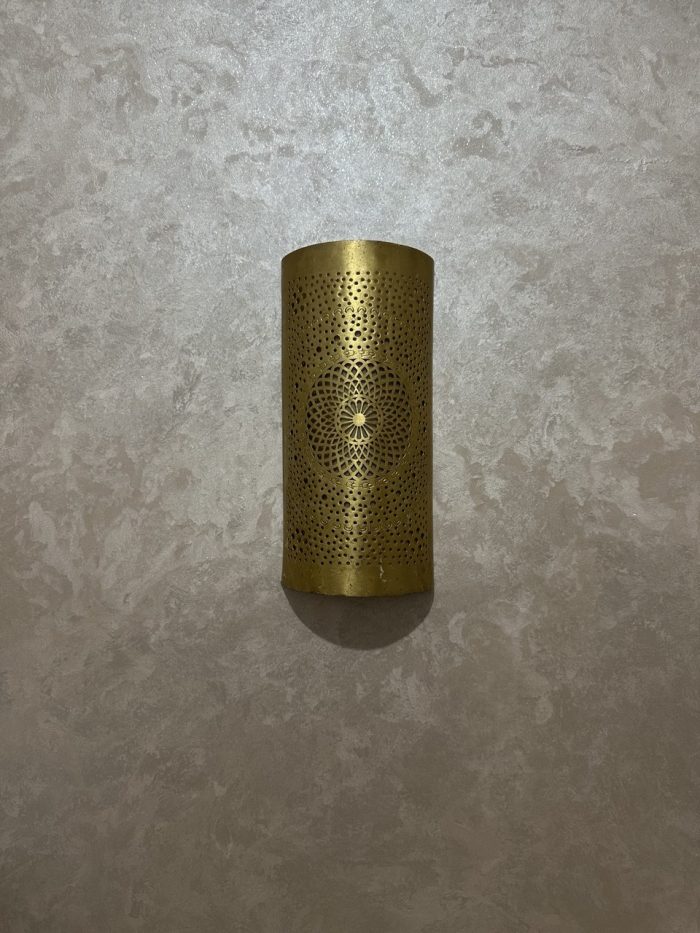 Handmade radiant rosette brass wall sconce with central geometric floral medallion and pierced decorative pattern.