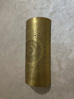 Handmade radiant rosette brass wall sconce with central geometric floral medallion and pierced decorative pattern.