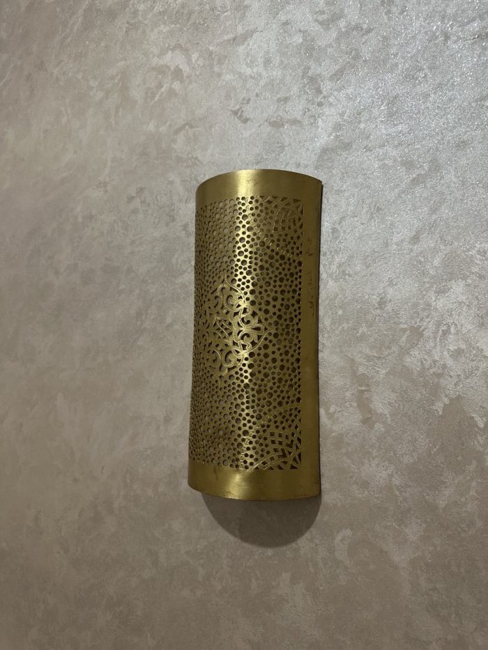 Handmade diamond medallion brass wall sconce with intricate perforated pattern and warm decorative up-and-down lighting.