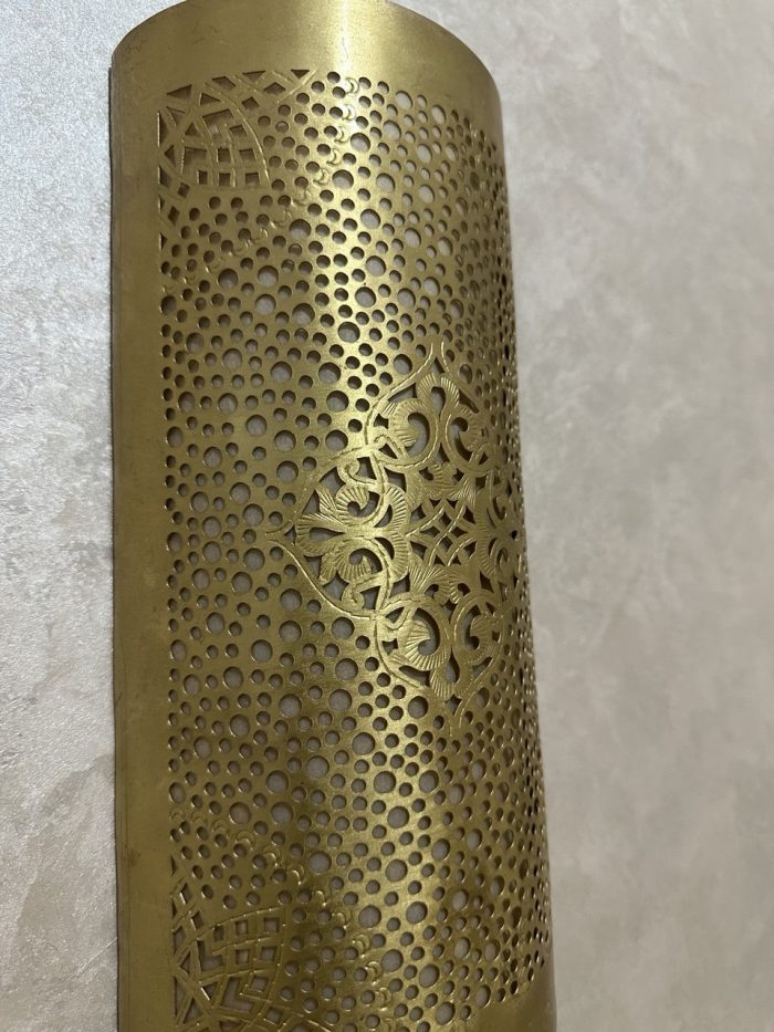 Handmade diamond medallion brass wall sconce with intricate perforated pattern and warm decorative up-and-down lighting.