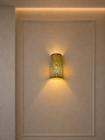 Handmade Moroccan brass wall sconce crafted from solid brass with intricate pierced detailing and warm up-and-down decorative illumination.
