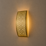 Handmade lattice filigree brass wall sconce with bowed rectangular shape, ornamental openwork and warm ambient lighting.