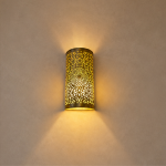 Handmade Moroccan brass wall sconce crafted from solid brass with intricate pierced detailing and warm up-and-down decorative illumination.