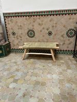 Handwoven Palm Leaf Bench handcrafted from solid eucalyptus wood with a natural woven palm leaf seat