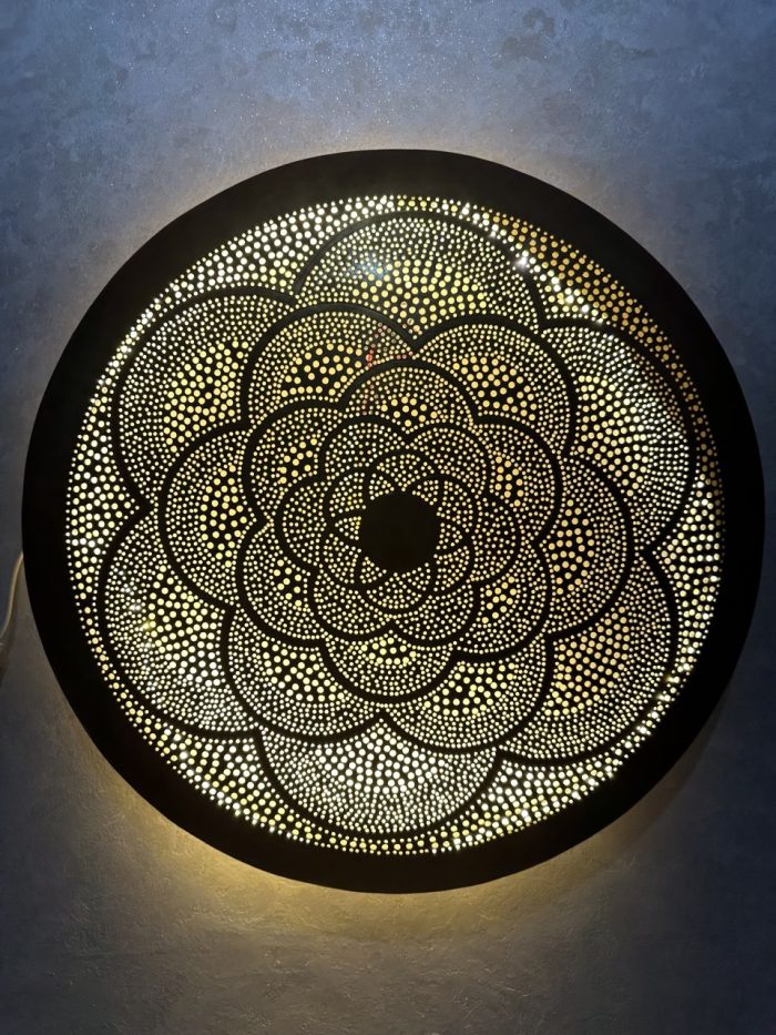 Moroccan Brass Flower Wall Light with handmade pierced rosette pattern and warm decorative glow