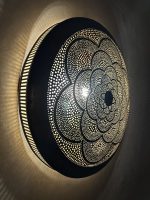 Moroccan Brass Flower Wall Light with handmade pierced rosette pattern and warm decorative glow