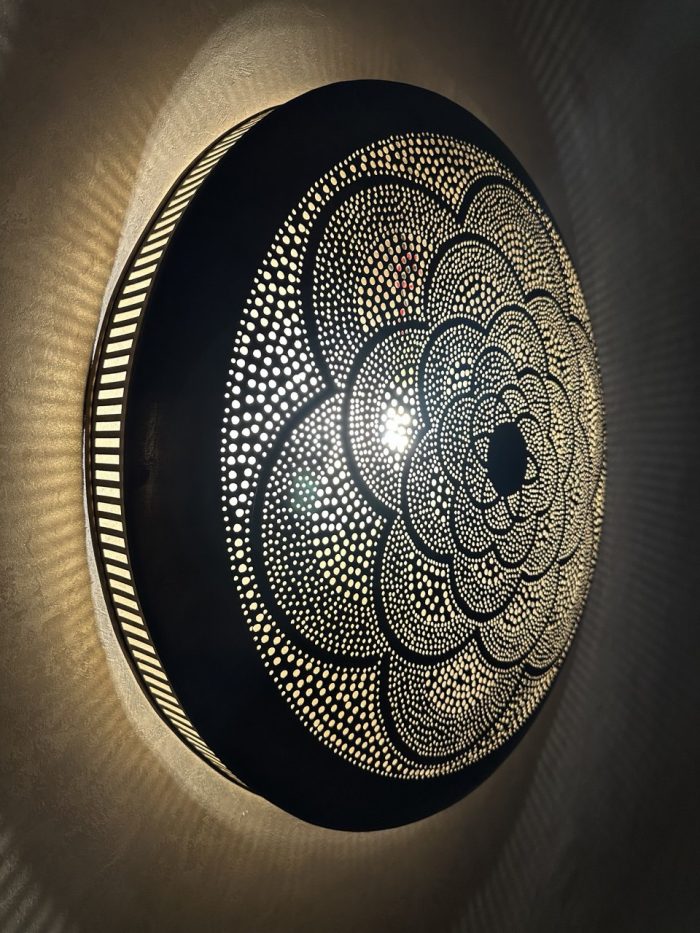 Moroccan Brass Flower Wall Light with handmade pierced rosette pattern and warm decorative glow
