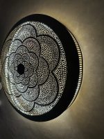 Moroccan Brass Flower Wall Light with handmade pierced rosette pattern and warm decorative glow