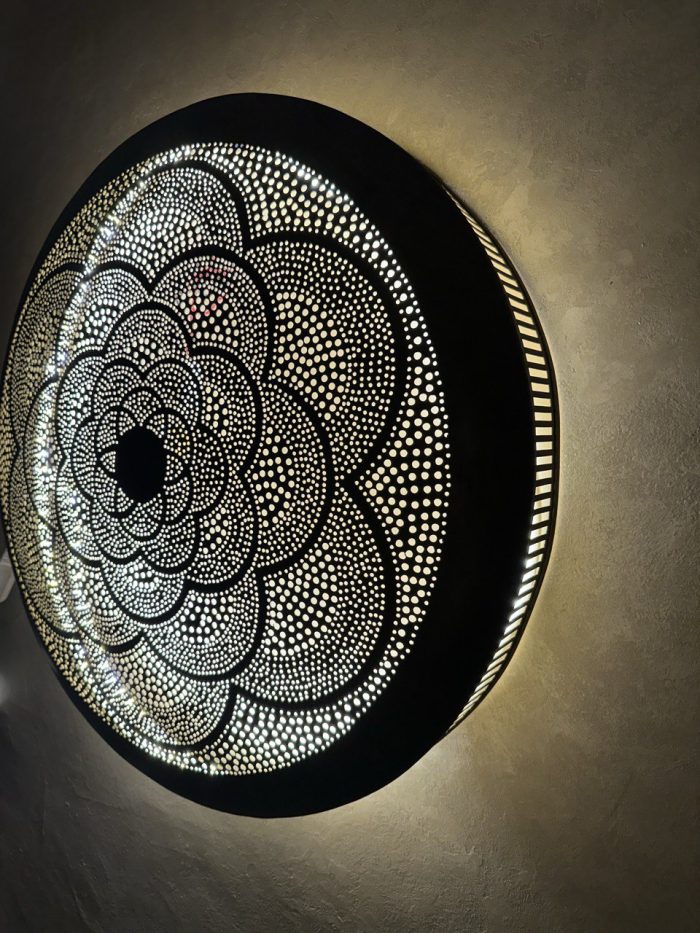 Moroccan Brass Flower Wall Light with handmade pierced rosette pattern and warm decorative glow