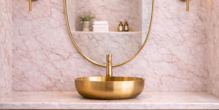 Curved Shield Brass Mirror displayed above entryway console with slim brass frame