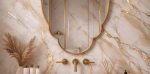 Quatrefoil Brass Mirror with sculpted frame above bathroom vanity