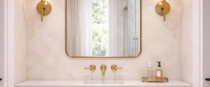 Handmade brass bathroom mirror with cloud arch top and slim brass frame