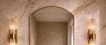 Rounded Arch Brass Mirror above bathroom vanity with handmade brass frame