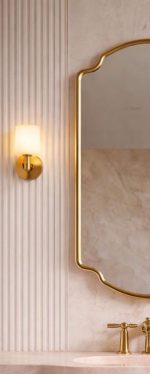 Crown Curve Brass Mirror above wood vanity with green tiled bathroom wall